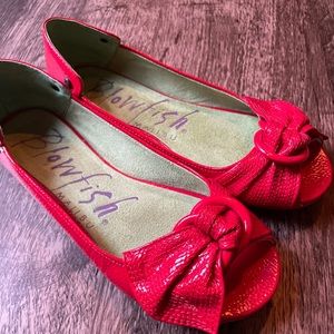 Bright red peep toe flats